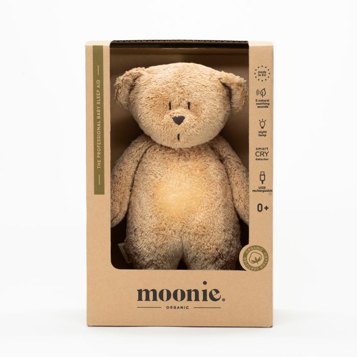 De slaapknuffel van Moonie in de vorm van een sand in de kleur rose voor baby's die rustgevende geluiden maakt die de slaap bevorderen  verpakking.