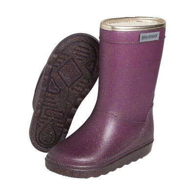 De thermoboots zijn gevoerd met wol aan de binnenzijde. De regenlaarzen zijn van ENFANT en glitter fig van kleur.