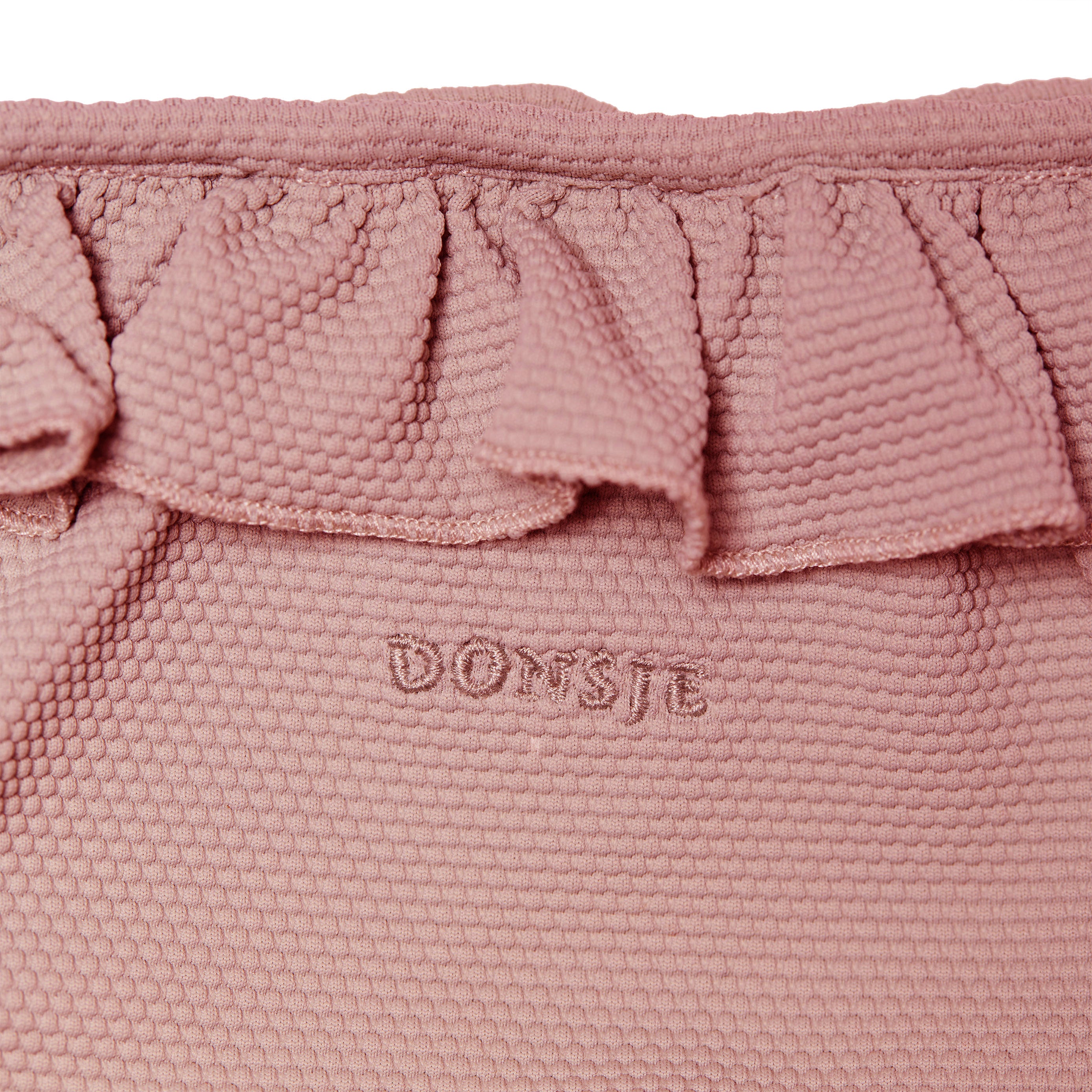 Bikini broek in de kleur rood met appel detail voor kinderen (meisjes) van Donsje. 