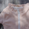 UV zwempak voor kinderen ter bescherming tegen de zon in het rose met lange mouwen..